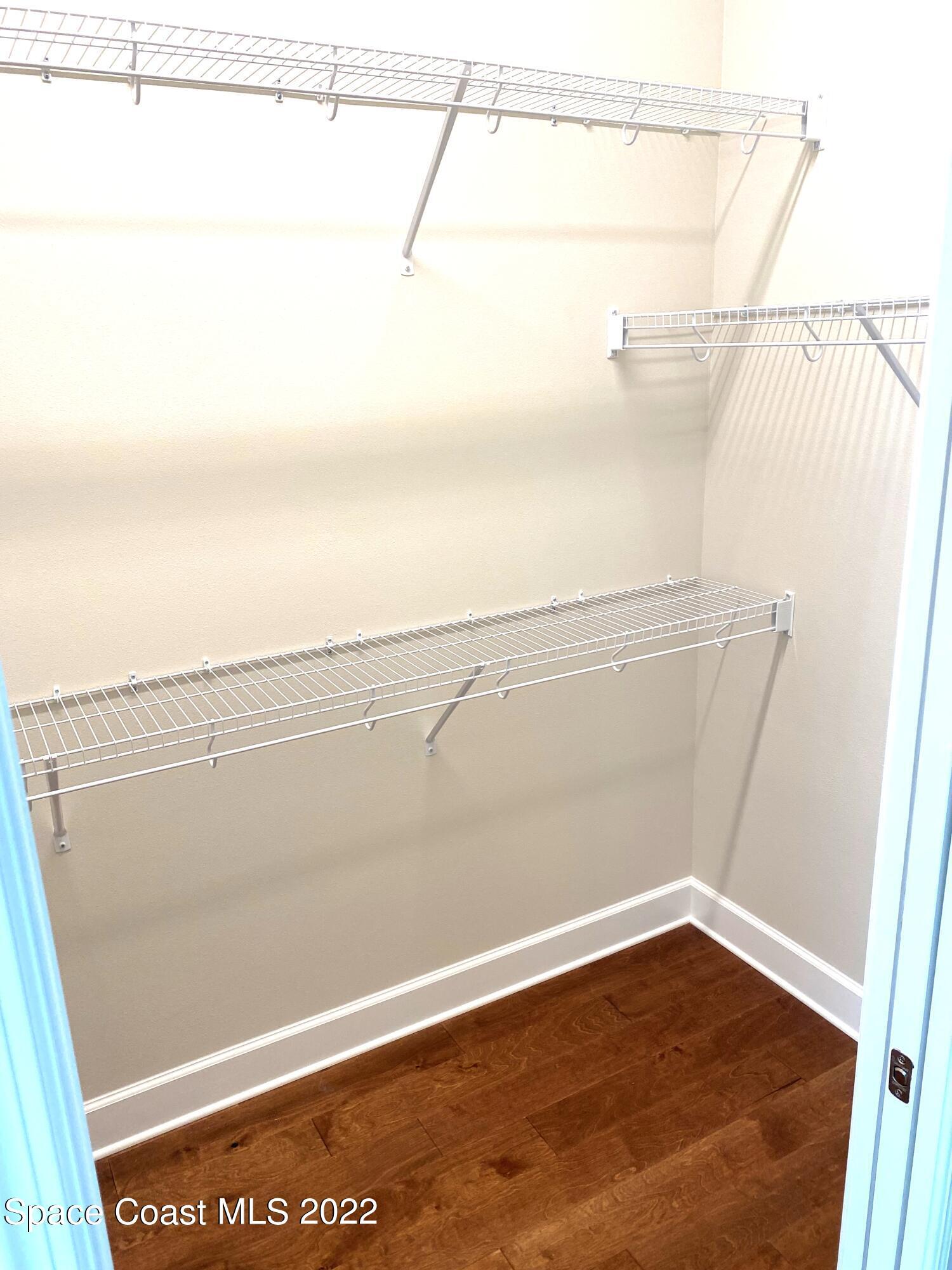 8321 Paragrass Avenue Melbourne, FL 32940 - Photo 23 of 41 a view of a room with racks on the wall