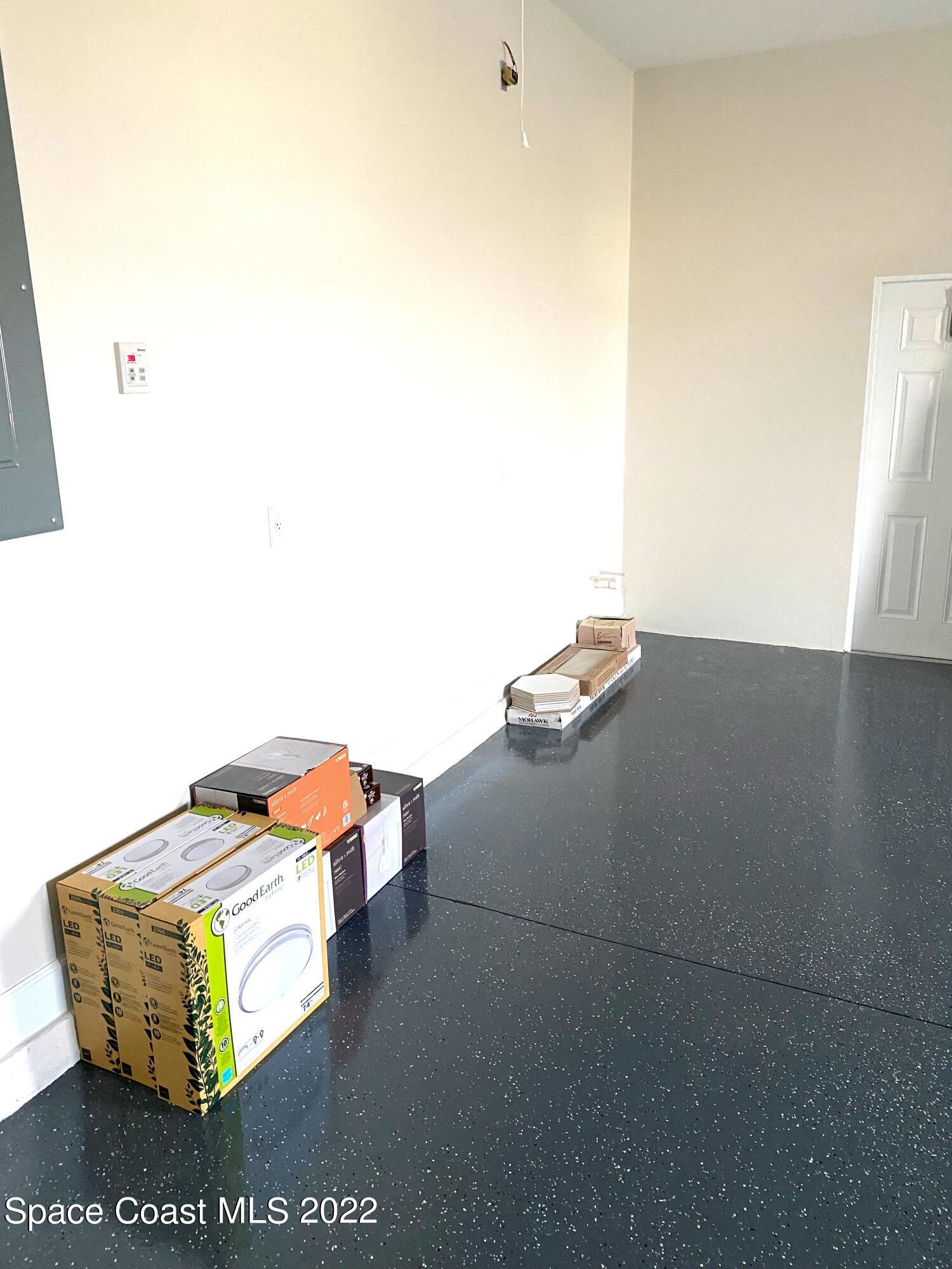 8321 Paragrass Avenue Melbourne, FL 32940 - Photo 32 of 41 a room with a couch