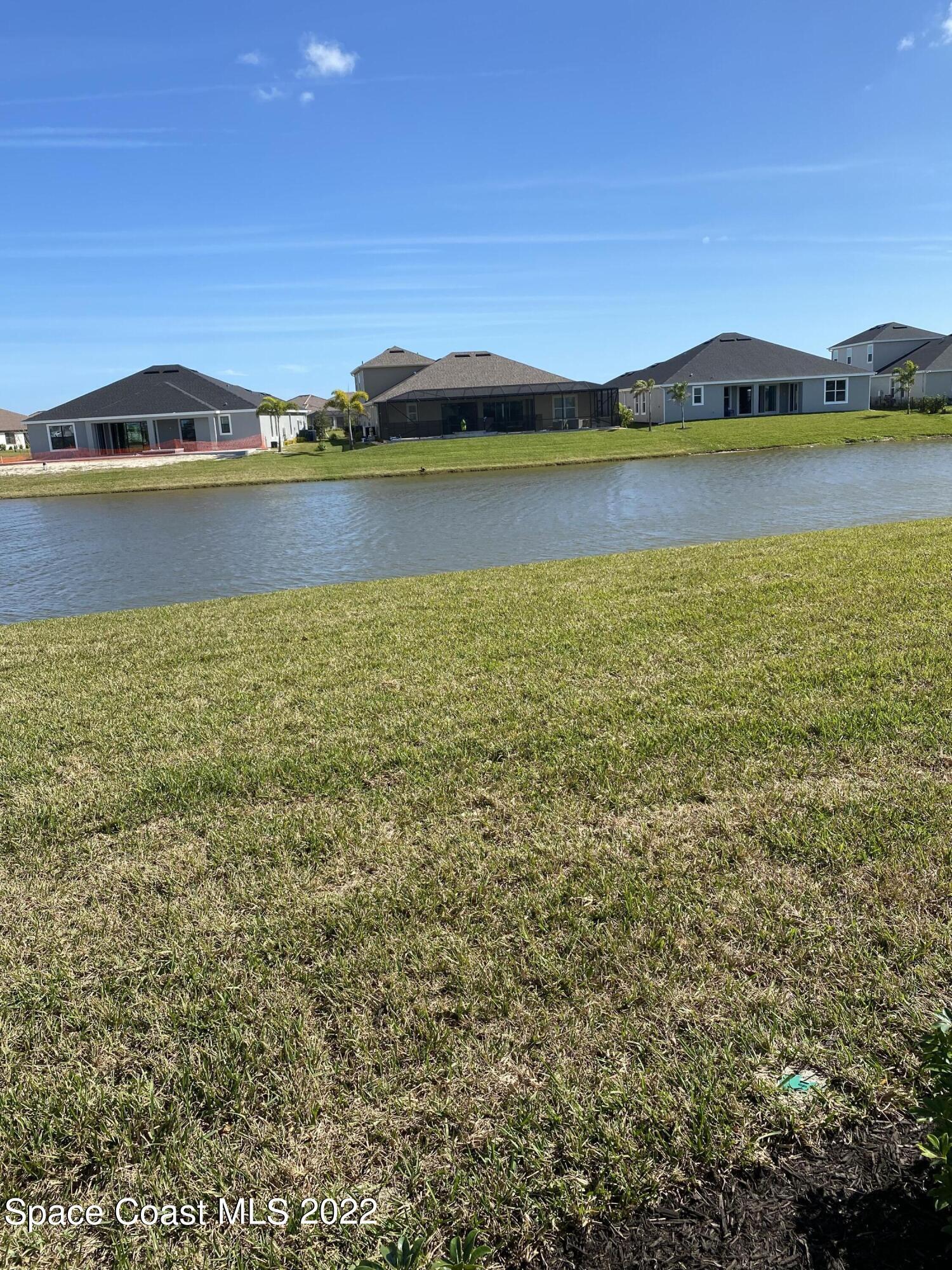 8321 Paragrass Avenue Melbourne, FL 32940 - Photo 40 of 41 a view of an ocean and beach
