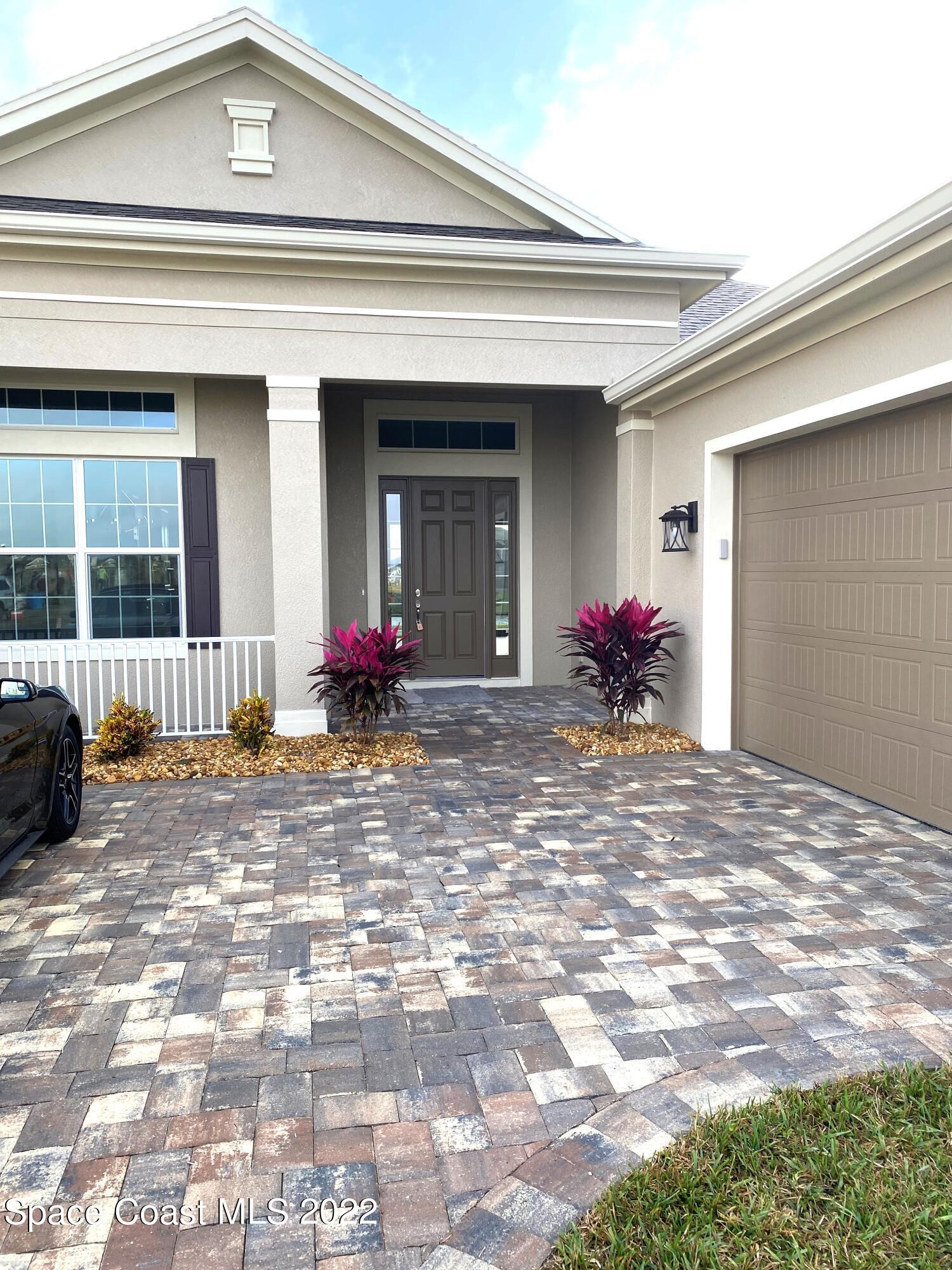8321 Paragrass Avenue Melbourne, FL 32940 - Photo 5 of 41 a front view of a house