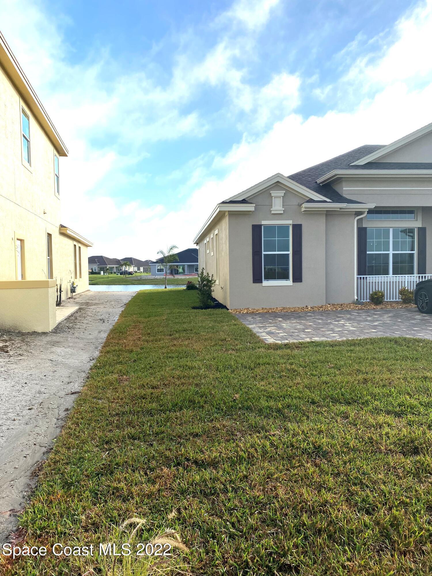 8321 Paragrass Avenue Melbourne, FL 32940 - Photo 6 of 41 a view of a house with a yard