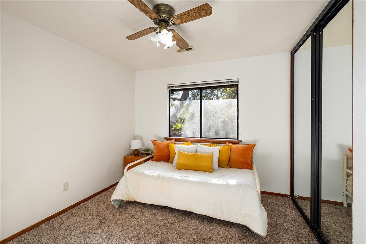 155 Pinewood Way Auburn, CA 95602 - Photo 18 of 92 a bedroom with a bed and ceiling fan