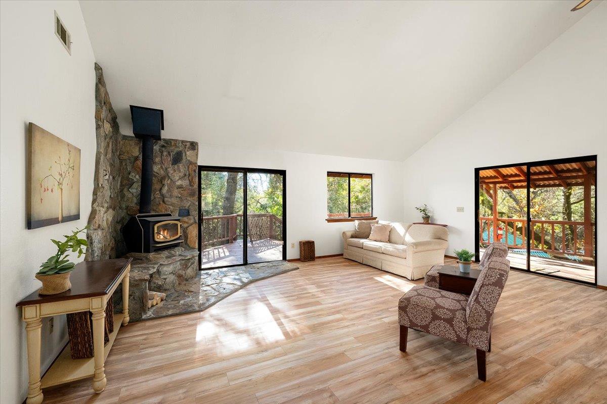 155 Pinewood Way Auburn, CA 95602 - Photo 38 of 92 a living room with furniture large window and wooden floor