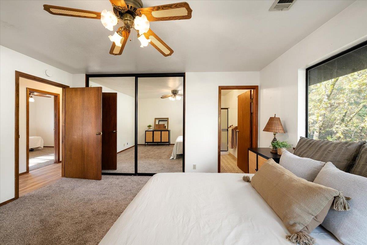 155 Pinewood Way Auburn, CA 95602 - Photo 48 of 92 a bedroom with furniture and a large window