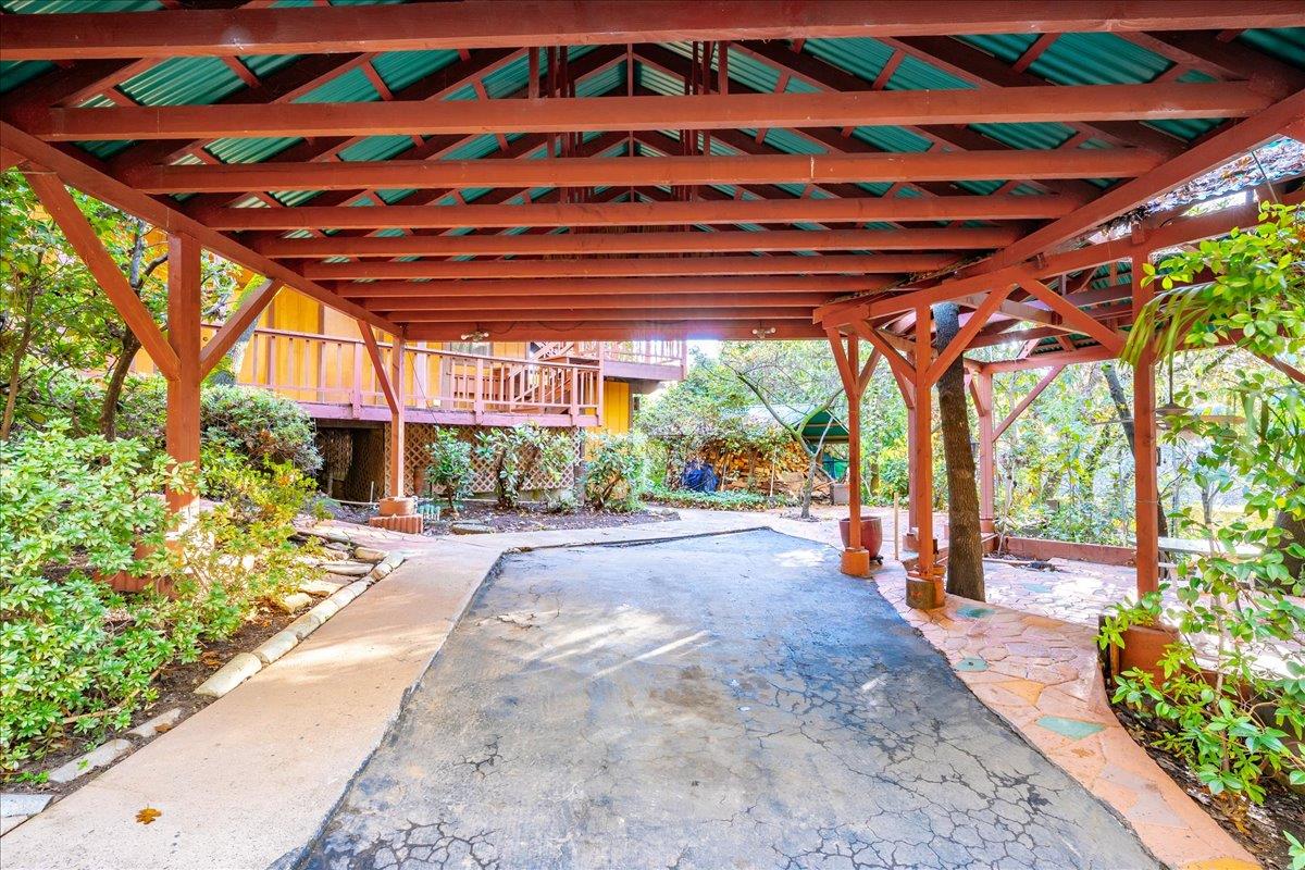 155 Pinewood Way Auburn, CA 95602 - Photo 79 of 92 a view of a patio with a table and chairs and potted plants