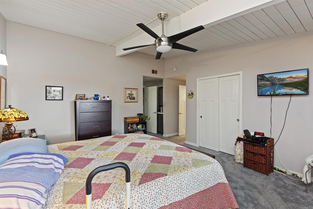 1387 Hygeia Avenue Encinitas, CA 92024 - Photo 12 of 45 a bedroom with a bed dresser and a flat tv screen