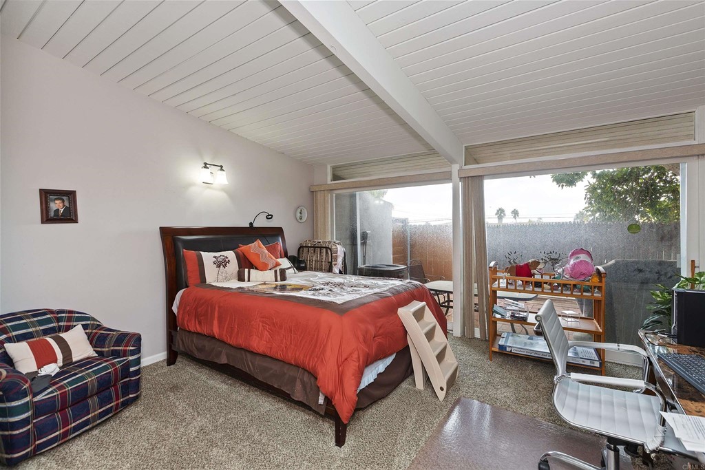 1387 Hygeia Avenue Encinitas, CA 92024 - Photo 13 of 45 a bedroom with a bed and a balcony view