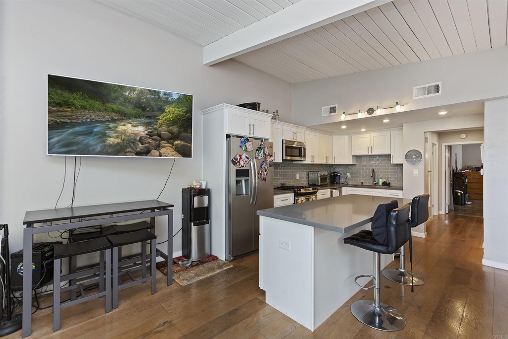 1387 Hygeia Avenue Encinitas, CA 92024 - Photo 18 of 45 a view of a dining room with furniture and wooden floor