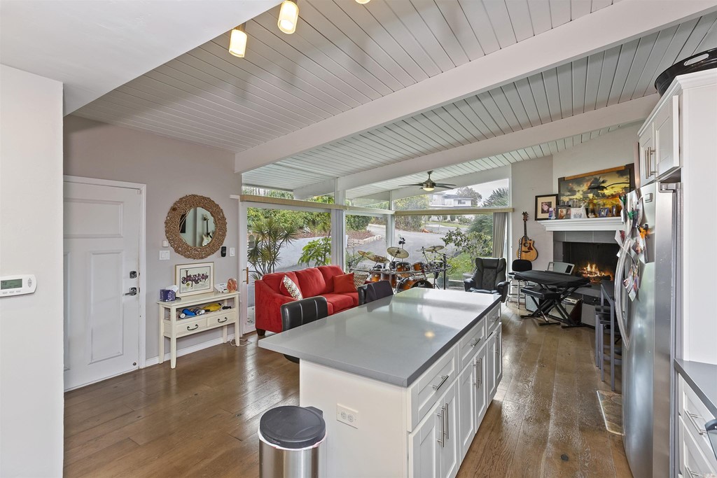 1387 Hygeia Avenue Encinitas, CA 92024 - Photo 21 of 45 a view of a dining room with furniture window and wooden floor