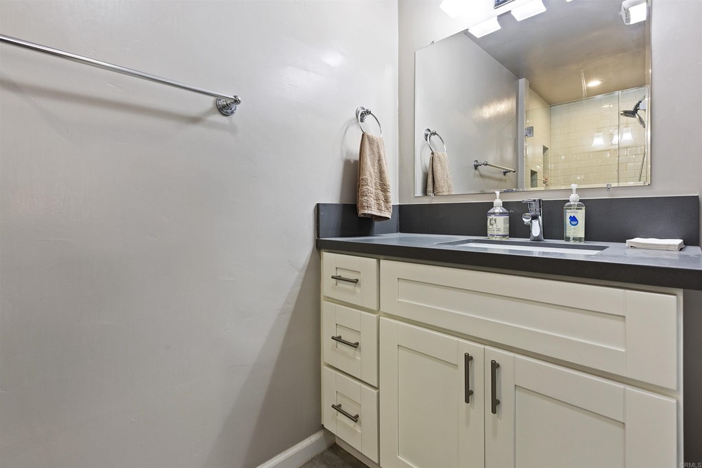 1387 Hygeia Avenue Encinitas, CA 92024 - Photo 25 of 45 a bathroom with a sink and a mirror
