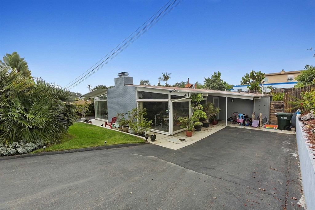 1387 Hygeia Avenue Encinitas, CA 92024 - Photo 4 of 45 a view of a house with a yard and potted plants