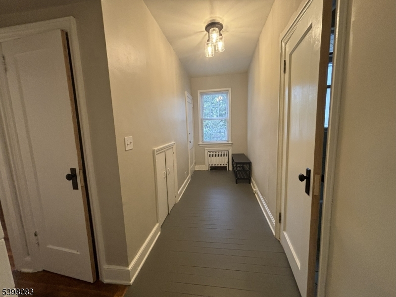 18 Laura Avenue, Unit 1 Nutley, NJ 07110 - Photo 18 of 27 a view of a hallway with a door and stairs