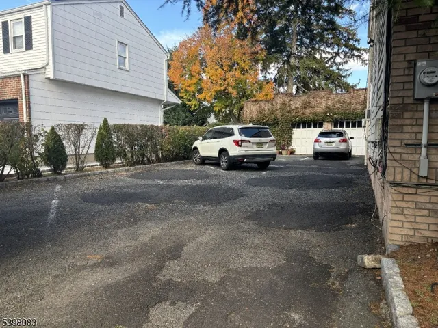a view of a car parked in front of a house