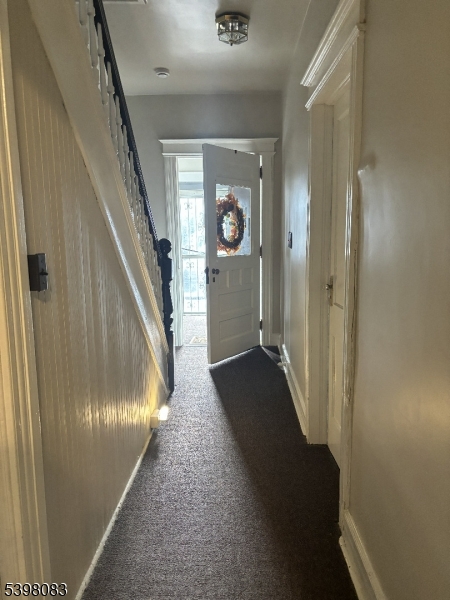 18 Laura Avenue, Unit 1 Nutley, NJ 07110 - Photo 3 of 27 a view of a hallway with wooden floor and staircase