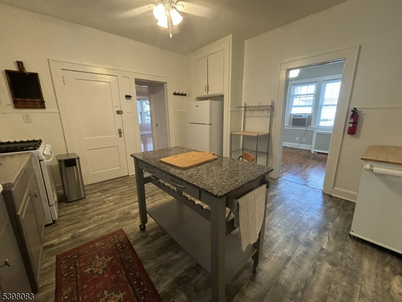 18 Laura Avenue, Unit 1 Nutley, NJ 07110 - Photo 7 of 27 a view of a kitchen counter space and wooden floor