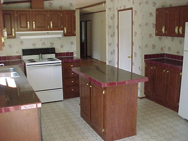 1611 Wildwood Road Salem, VA 24153 - Photo 2 of 6 a kitchen with stainless steel appliances granite countertop a refrigerator a stove and a sink