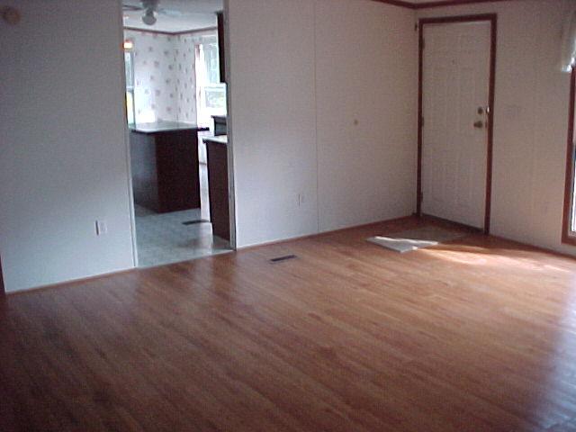 1611 Wildwood Road Salem, VA 24153 - Photo 6 of 6 an empty room with wooden floor and cabinet