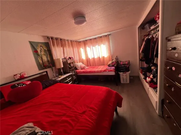 a bedroom with bed and a window