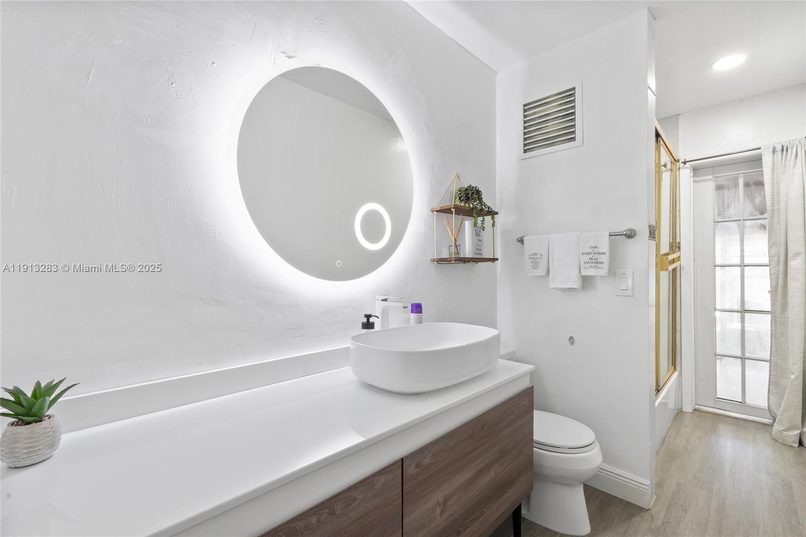12535 Southwest 219th Street Miami, FL 33170 - Photo 13 of 31 a bathroom with a sink vanity granite and toilet