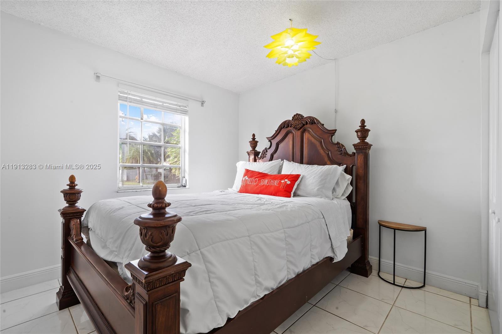 12535 Southwest 219th Street Miami, FL 33170 - Photo 15 of 31 a bedroom with a bed and painting on the wall