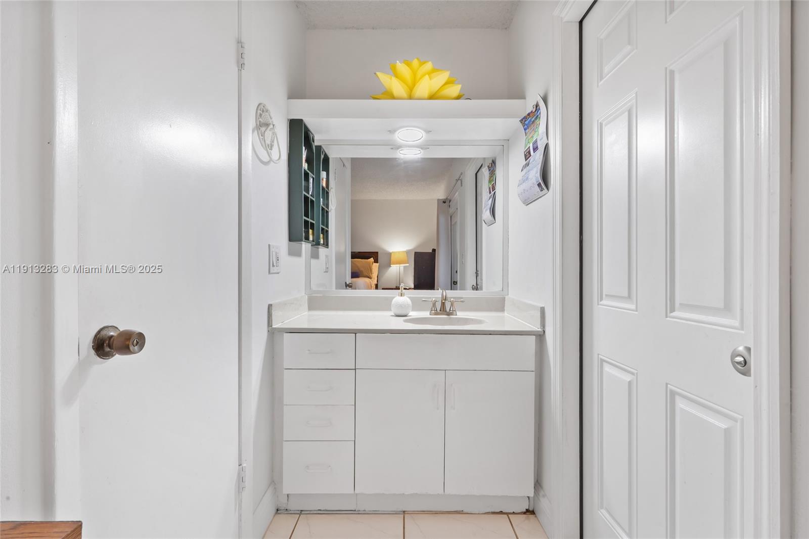 12535 Southwest 219th Street Miami, FL 33170 - Photo 19 of 31 a bathroom with a sink and a mirror