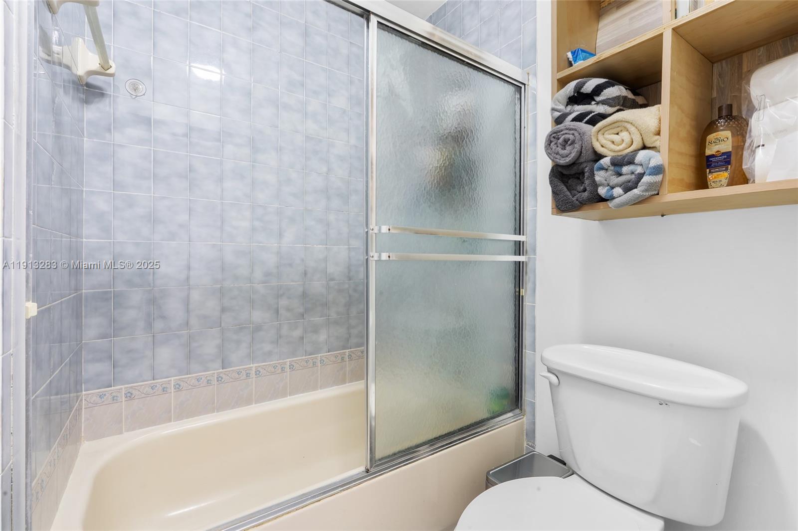 12535 Southwest 219th Street Miami, FL 33170 - Photo 20 of 31 a bathroom with a shower and a toilet