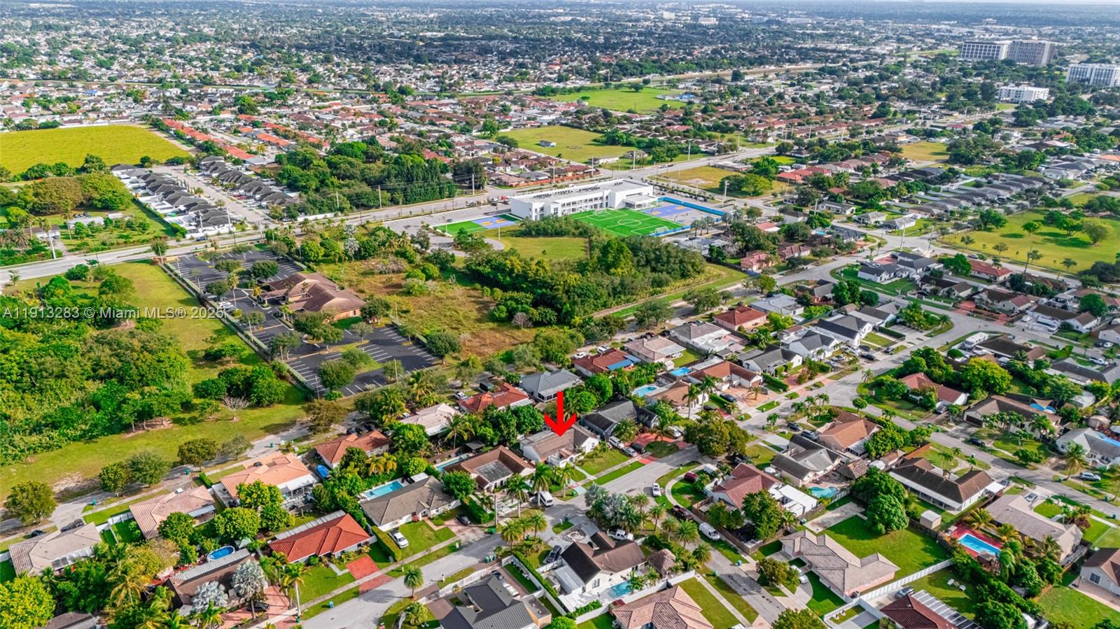 12535 Southwest 219th Street Miami, FL 33170 - Photo 26 of 31 an aerial view of residential houses with outdoor space and trees