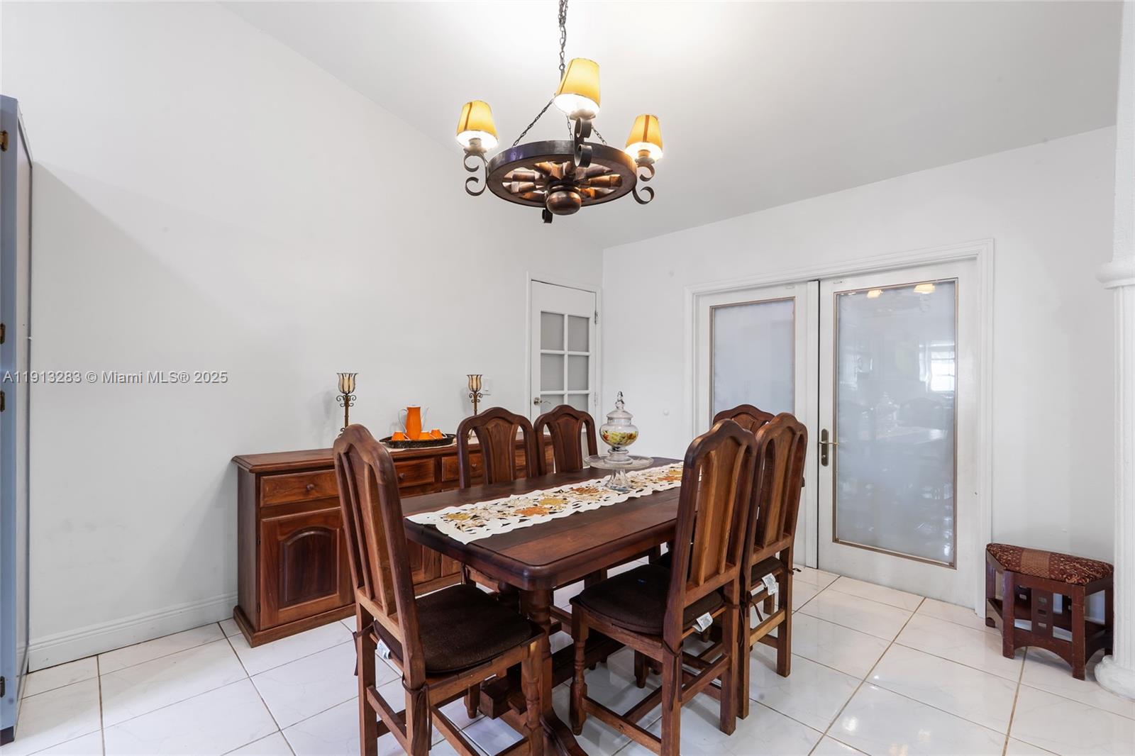 12535 Southwest 219th Street Miami, FL 33170 - Photo 7 of 31 a dining room with furniture and chandelier