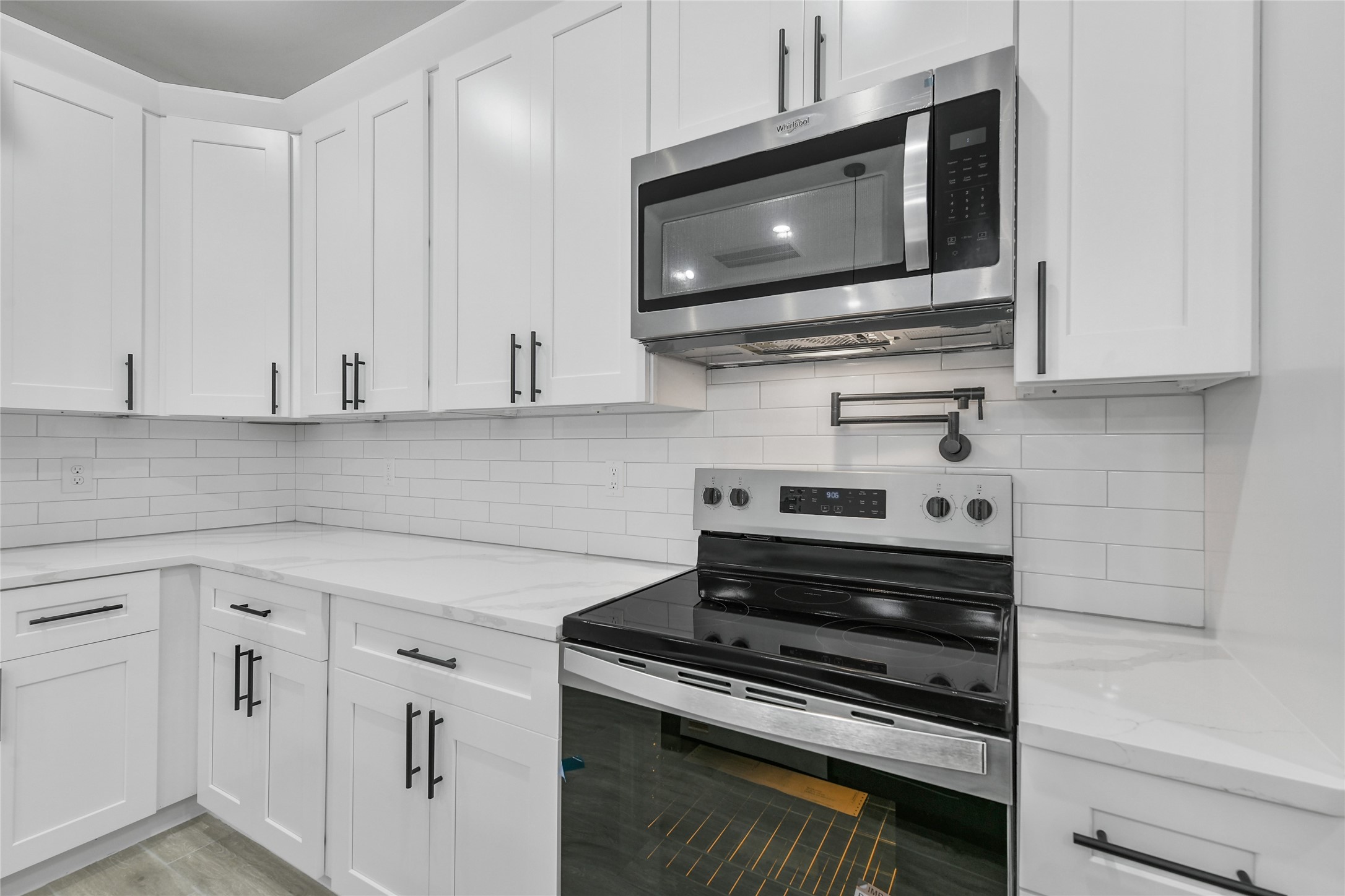 15113 Austin Road Willis, TX 77378 - Photo 14 of 37 a kitchen with appliances a sink and cabinets