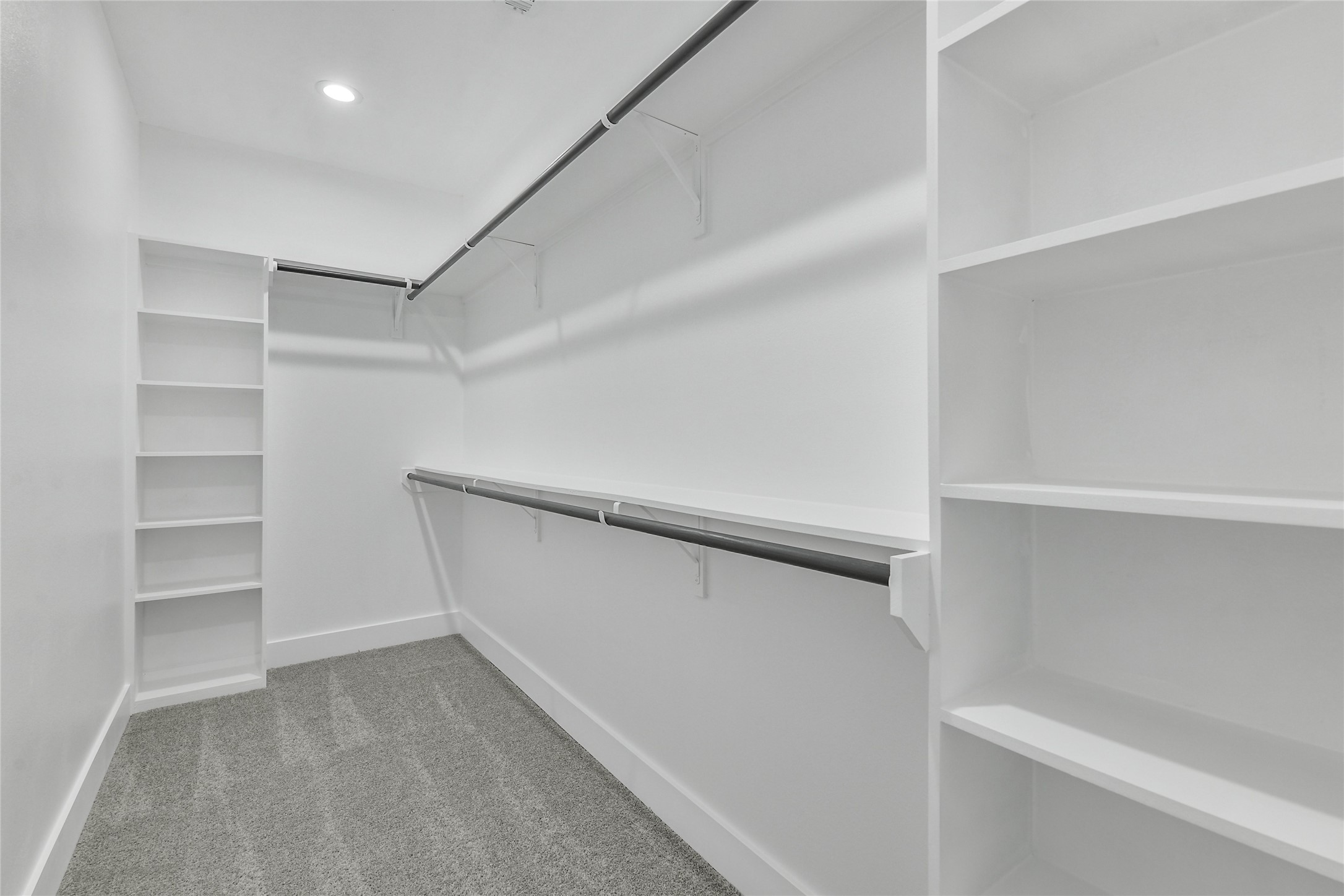 15113 Austin Road Willis, TX 77378 - Photo 23 of 37 a view of an empty walk in closet