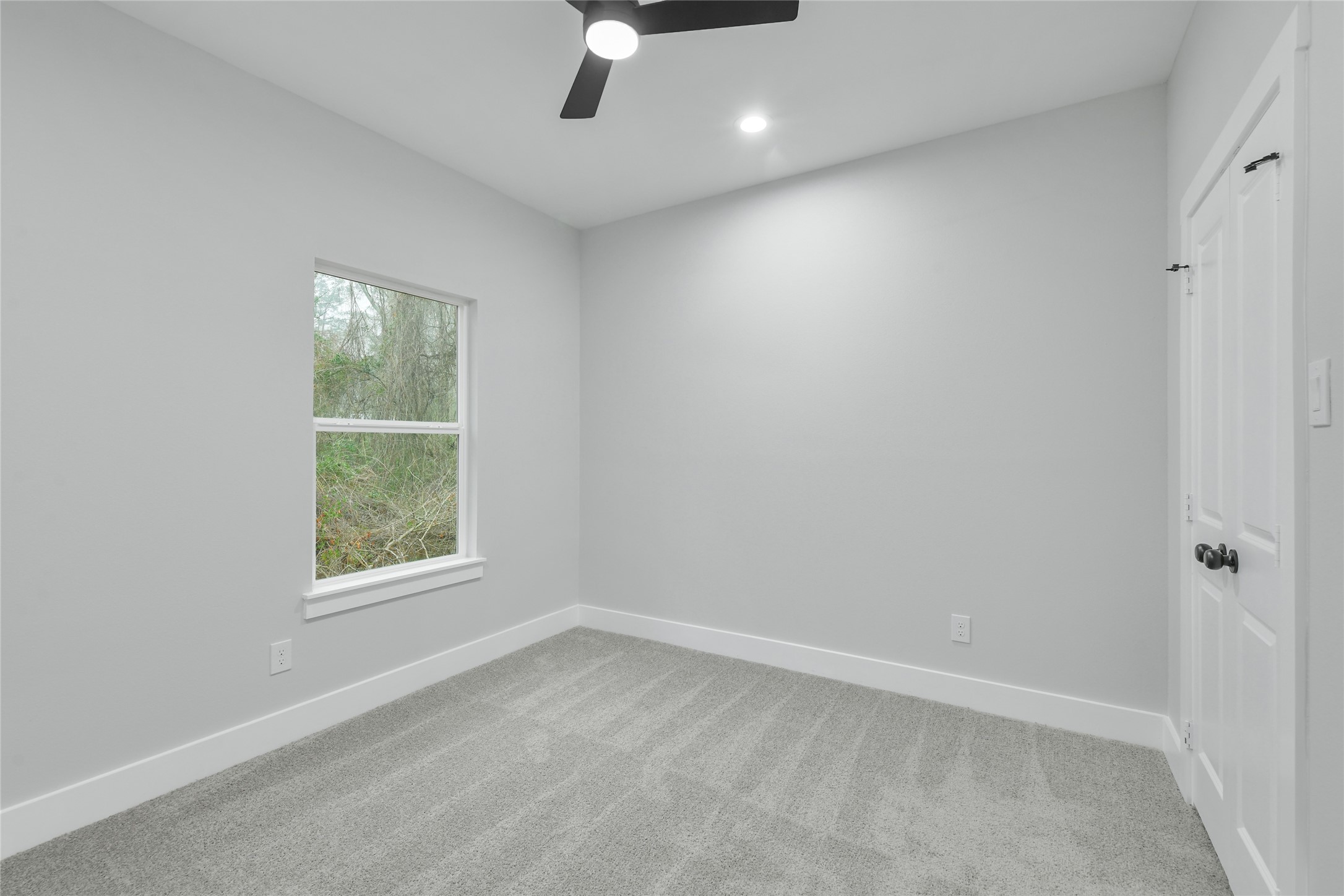15113 Austin Road Willis, TX 77378 - Photo 28 of 37 an empty room with a window