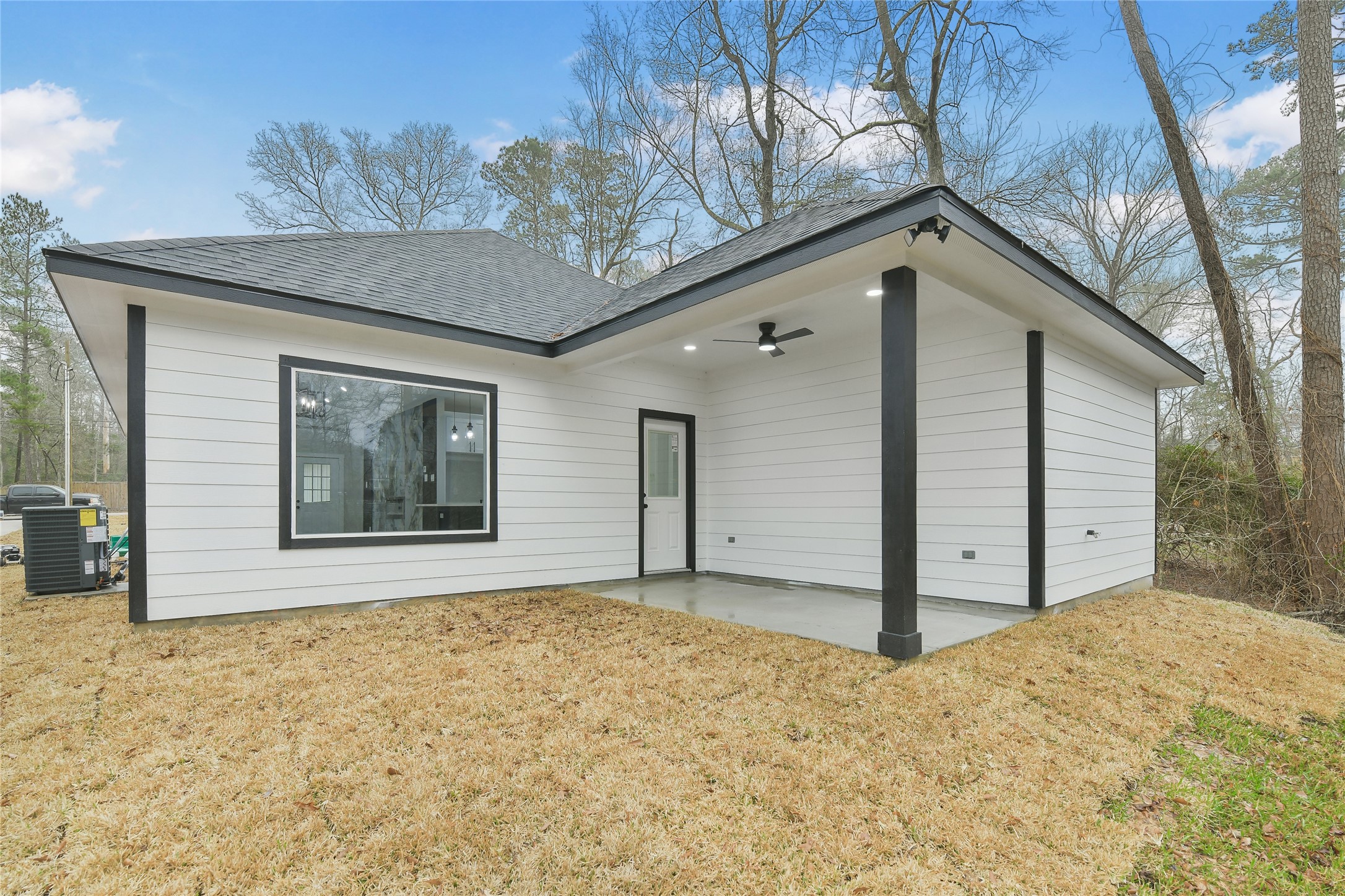 15113 Austin Road Willis, TX 77378 - Photo 31 of 37 a view of a house with a wooden fence