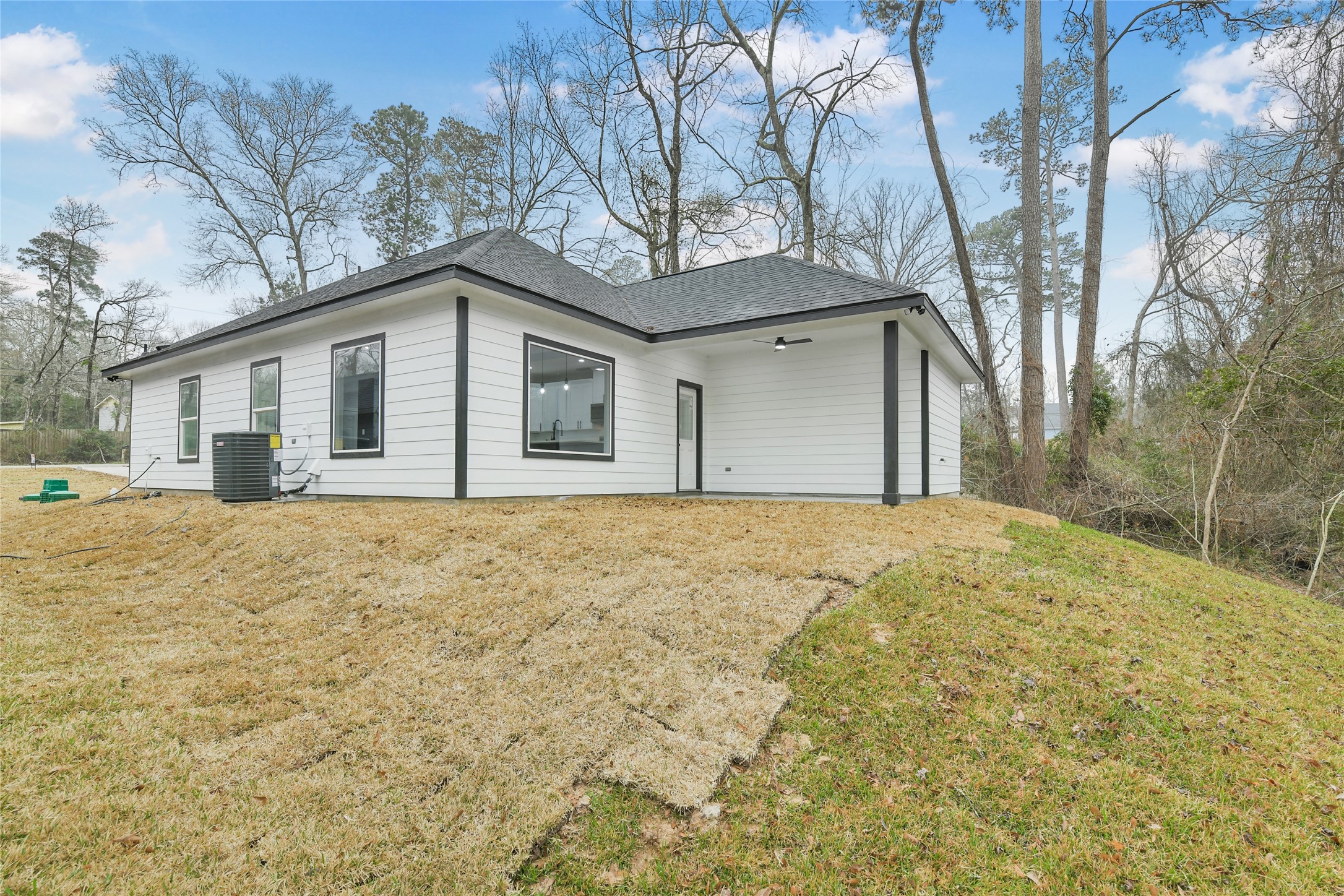 15113 Austin Road Willis, TX 77378 - Photo 32 of 37 a front view of a house with a yard