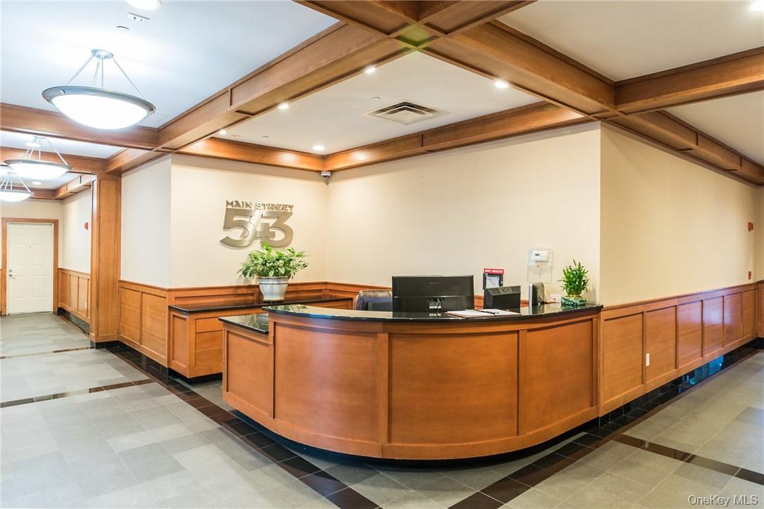 543 Main Street, Unit 410 New Rochelle, NY 10801 - Photo 1 of 24 a kitchen with stainless steel appliances granite countertop a sink a stove and a wooden floors