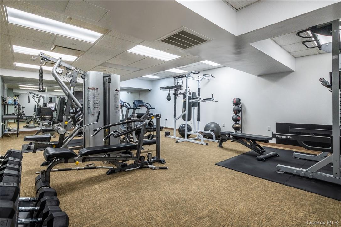 543 Main Street, Unit 410 New Rochelle, NY 10801 - Photo 16 of 24 a view of a room with gym equipment