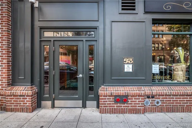 a front view of a building with street view