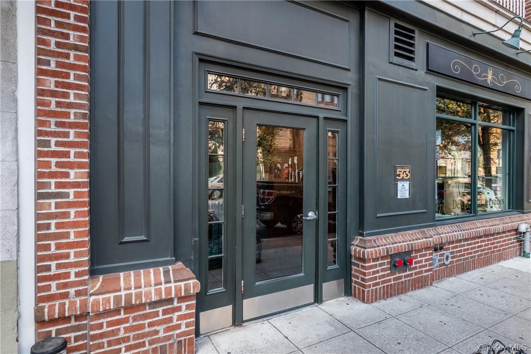 543 Main Street, Unit 410 New Rochelle, NY 10801 - Photo 20 of 24 a front view of a building with door