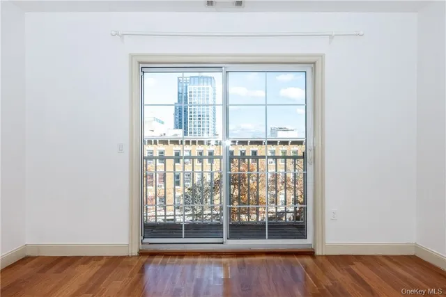 a view of wooden floor and brick walls