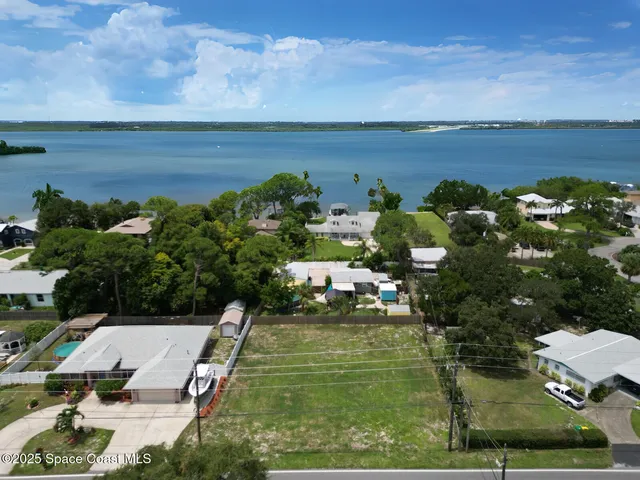 a aerial view of a house with a yard