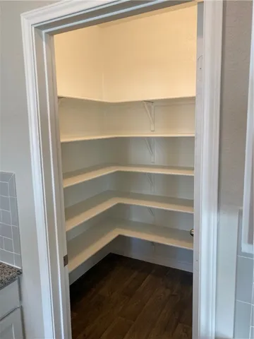 a storage room with wooden floor