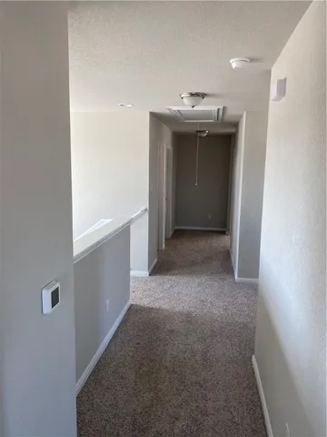 a view of a hallway with an empty room