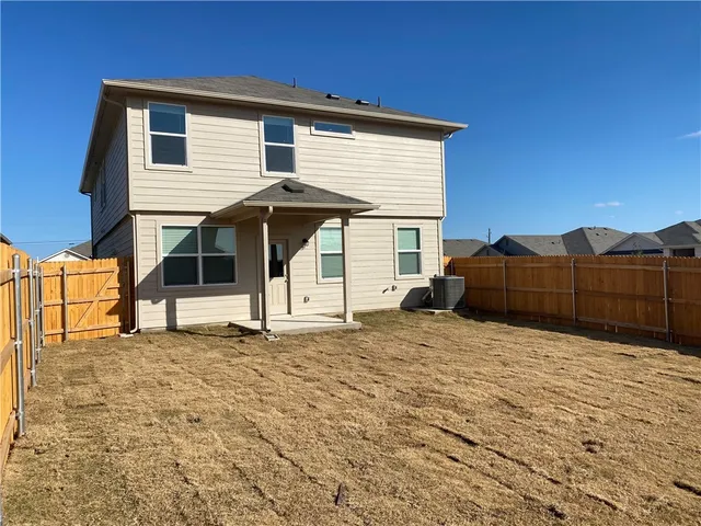 a view of a house with a snow in the yard