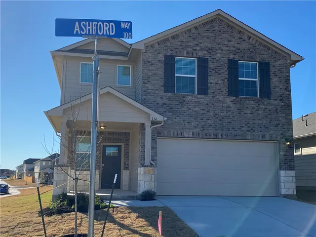 a front view of a house with glass windows