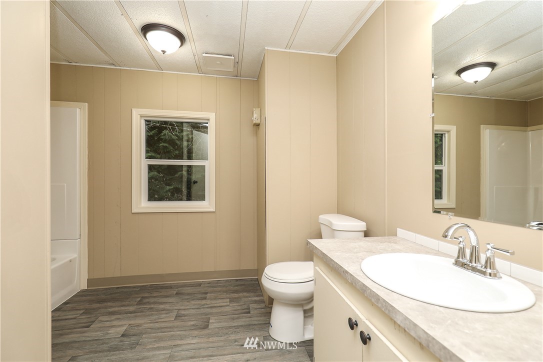 176 Palmer Road Napavine, WA 98532 - Photo 12 of 16 a bathroom with a toilet sink and mirror