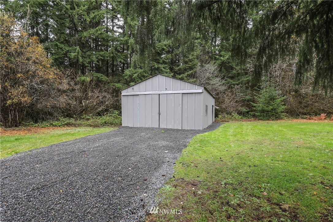 176 Palmer Road Napavine, WA 98532 - Photo 15 of 16 a house with green field in front of it