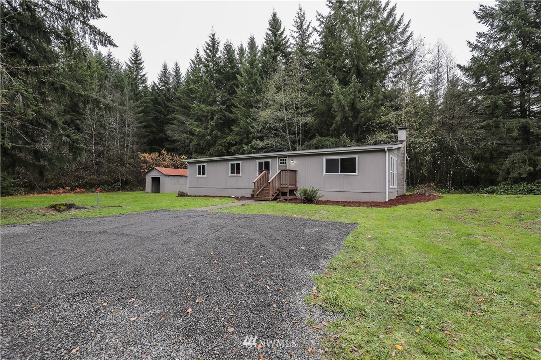 176 Palmer Road Napavine, WA 98532 - Photo 3 of 16 a view of a house with backyard and trees
