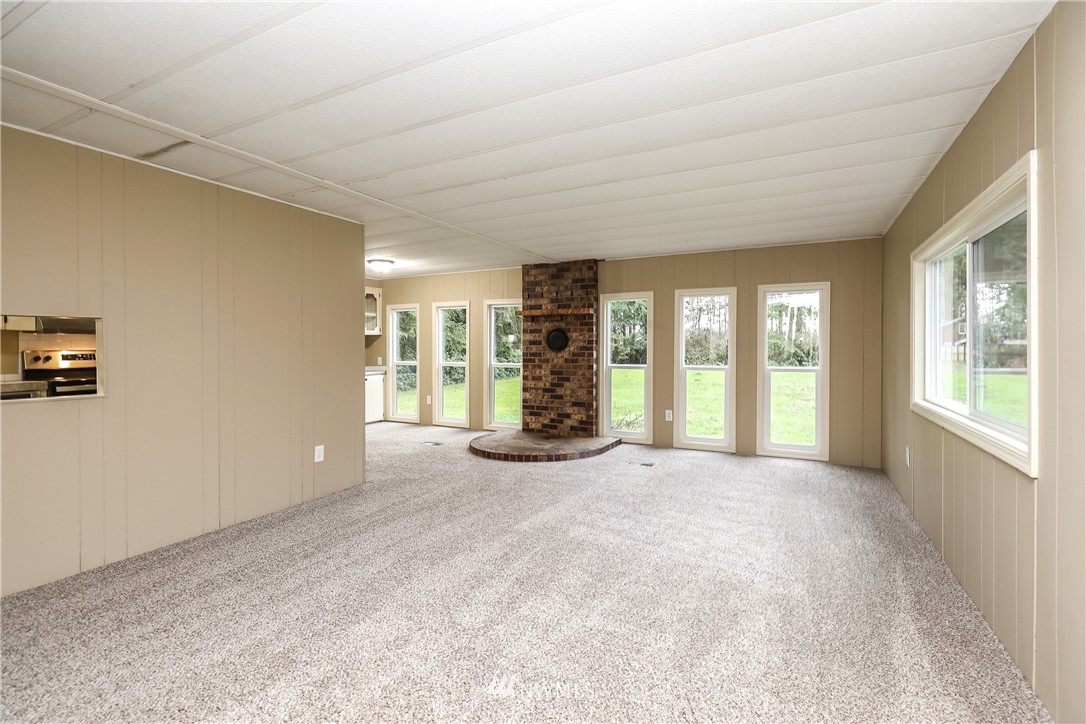 176 Palmer Road Napavine, WA 98532 - Photo 5 of 16 a view of an empty room with glass door