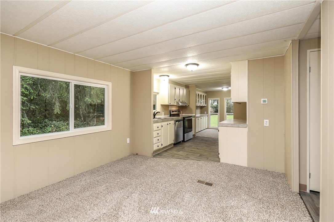 176 Palmer Road Napavine, WA 98532 - Photo 8 of 16 a view of a kitchen with furniture and a window