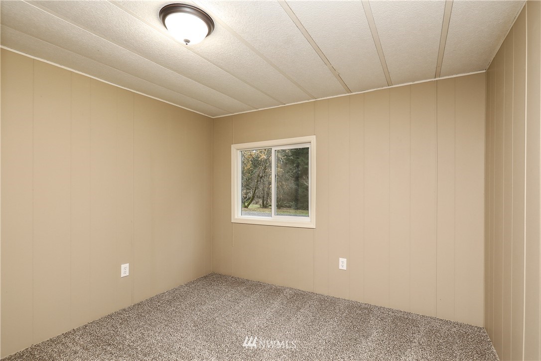 176 Palmer Road Napavine, WA 98532 - Photo 9 of 16 a view of an empty room with a window