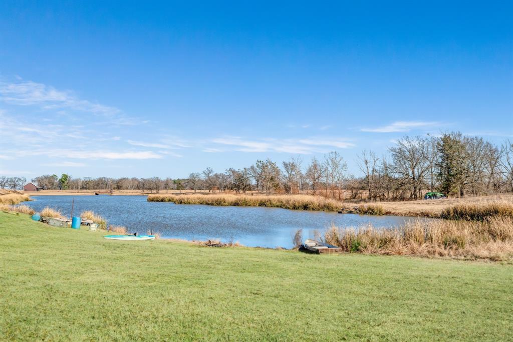 4060 County Road 36220 Sumner, TX 75486 - Photo 20 of 40 a view of a lake with houses in the back